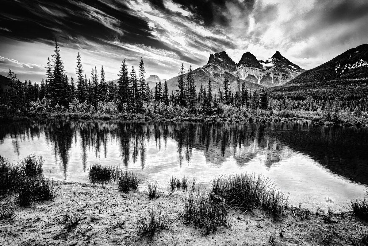 Alpine Reflection: The Three Sisters at Canmore