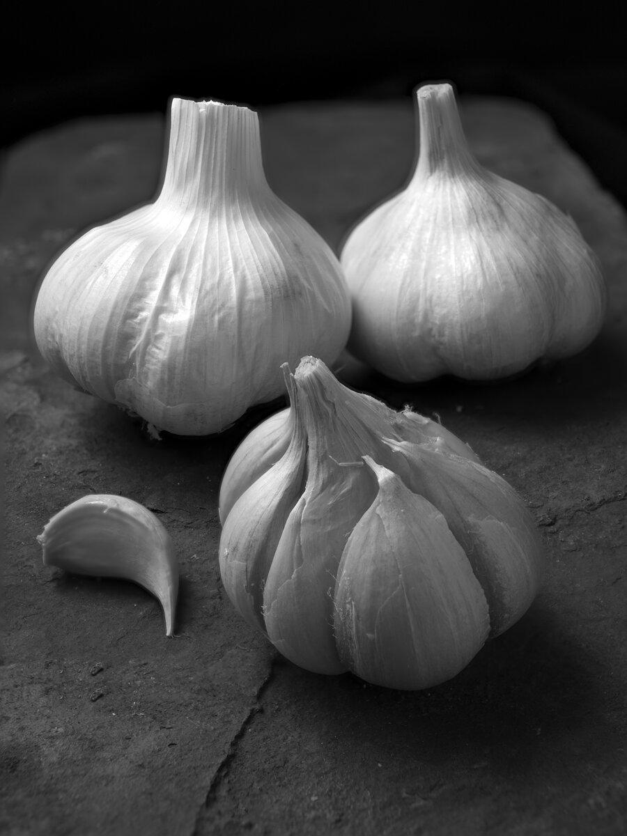 Close up of garlic on a textured surface