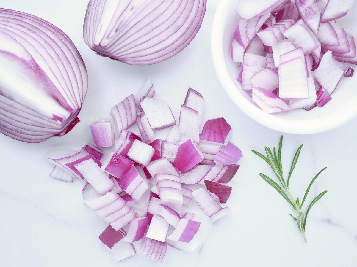 Chopped red onions and a sprig of rosemary