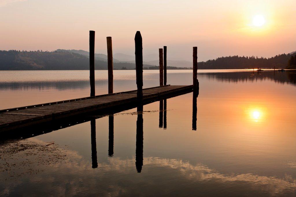 Tranquil warm sunrise over lake