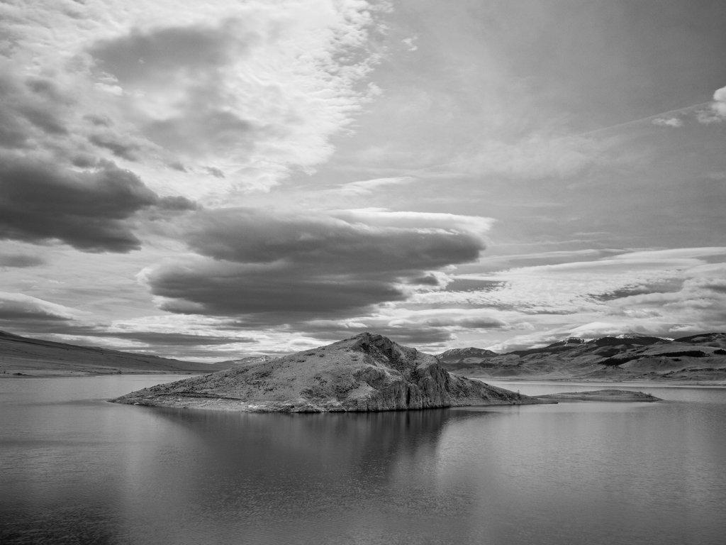 Black and white photo of island in a lake